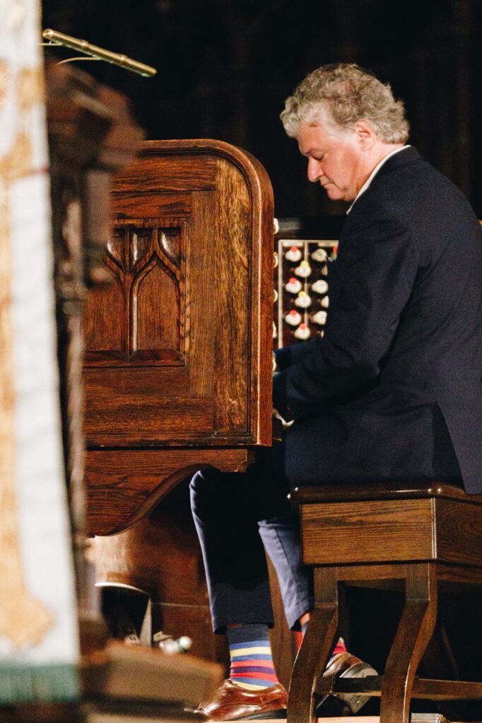 A m,an playing the organ.